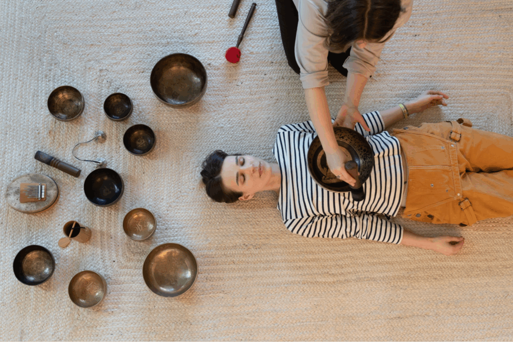 A person receiving a sound bath.